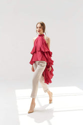 Tailored high-waisted silk pants with tapered leg and rolled cuffs for refined style